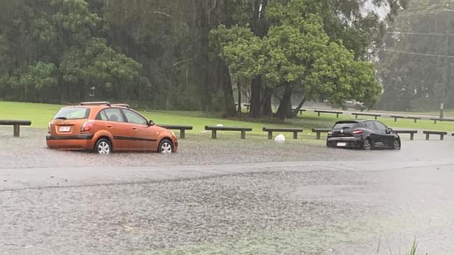 Cars submerged in flood waters in Nuban Street at Currumbin Waters. Photo:  Breeza Tolan/Facebook