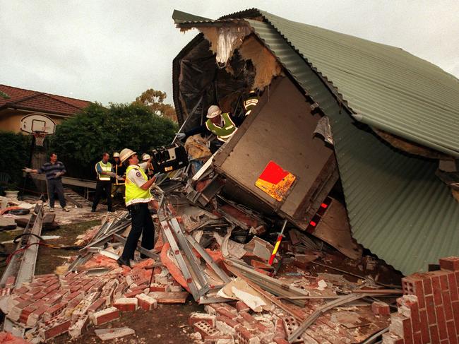 Rescue workers at Emma Street, after a truck travelling along Mona Vale Road lost control, crashed into a car and then crashed into a house.