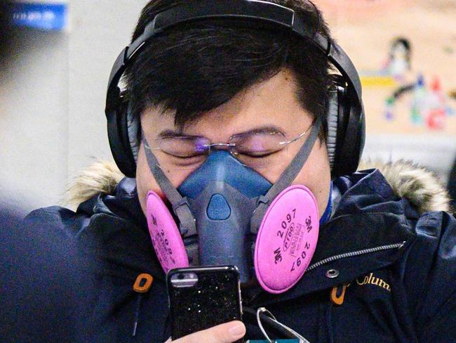 A man wearing a respirator mask to stave off the virus. Picture: AFP