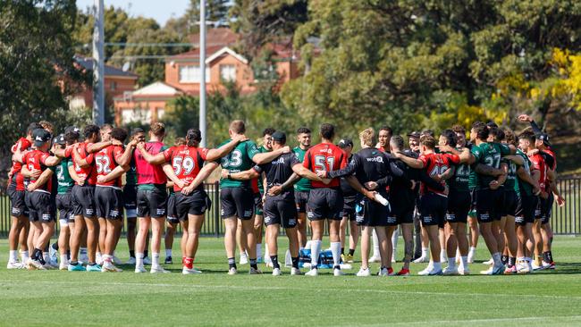 South Sydney players huddle during training on Thursday. Picture: Max Mason-Hubers