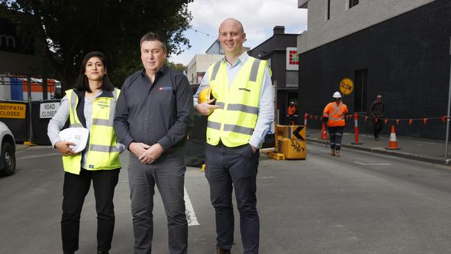 Rose Stranan project manger for Forestry redevelopment UTAS, Scott Henderson store owner/manager Choices Flooring, Alex Gorton Hansen Yuncken. Brisbane Street is beginning to re-open again after being closed for some time due to construction taking place at the old Freedom building that has now been taken over by UTAS. Picture: Nikki Davis-Jones