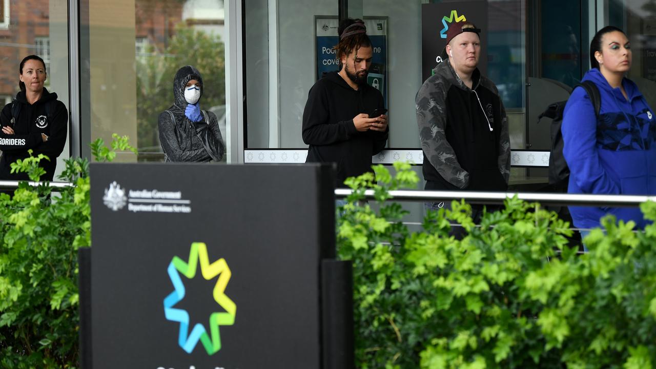 People queue outside a Centrelink office in Bondi Junction as the coronavirus pandemic started to take hold in March 2020. Picture: AAP Image/Joel Carrett