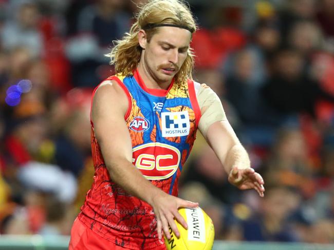 GOLD COAST, AUSTRALIA - JULY 13: Brad Scheer of the Suns kicks during the round 17 AFL match between the Gold Coast Suns and the Adelaide Crows at Metricon Stadium on July 13, 2019 in Gold Coast, Australia. (Photo by Chris Hyde/Getty Images)