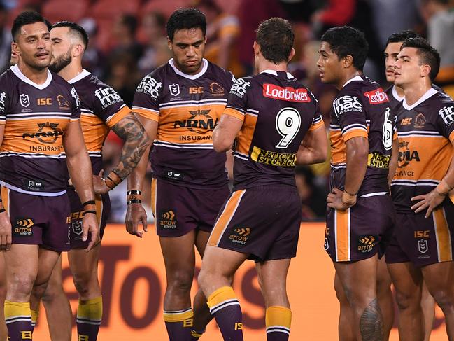 Broncos players are dejected after losing yet again.