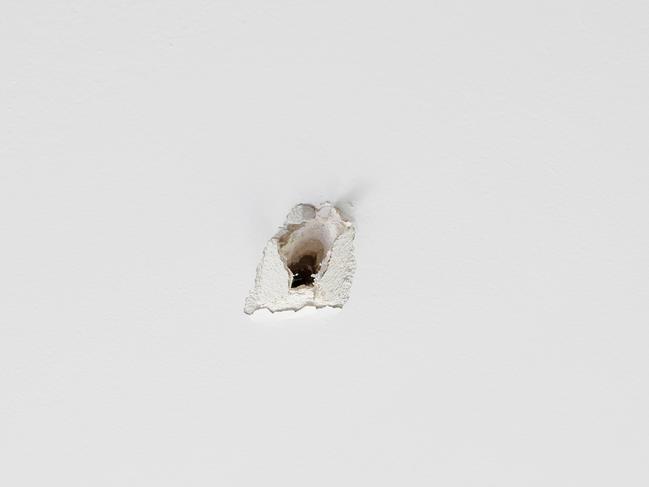 The bullet hole in the ceiling. Picture: Brendan Beckett