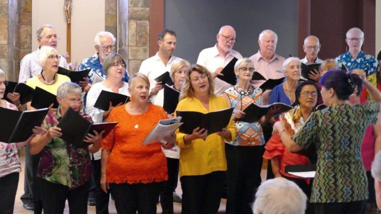 Choir leader Linda Gefken leading the Waves of Harmony choir in rehearsals.