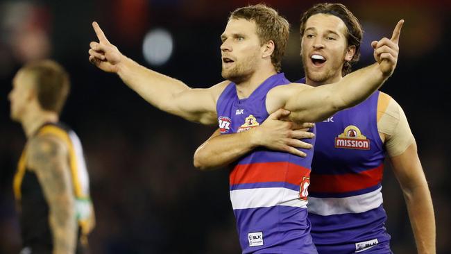 Jake Stringer celebrates a goal with Marcus Bontempelli.