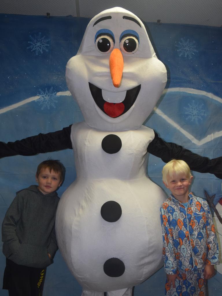 PARTY TIME: Tyliah Steven and Billy Galloway meet Olaf at the Blue Light Disco. Photo: Alex Nolan / Stanthorpe Border Post