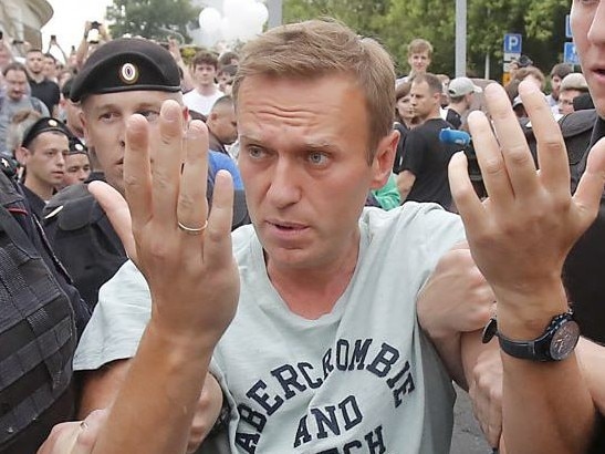 Russian opposition leader Alexei Navalny is led away by police. Picture: Supplied