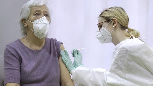 A woman gets her covid jab.