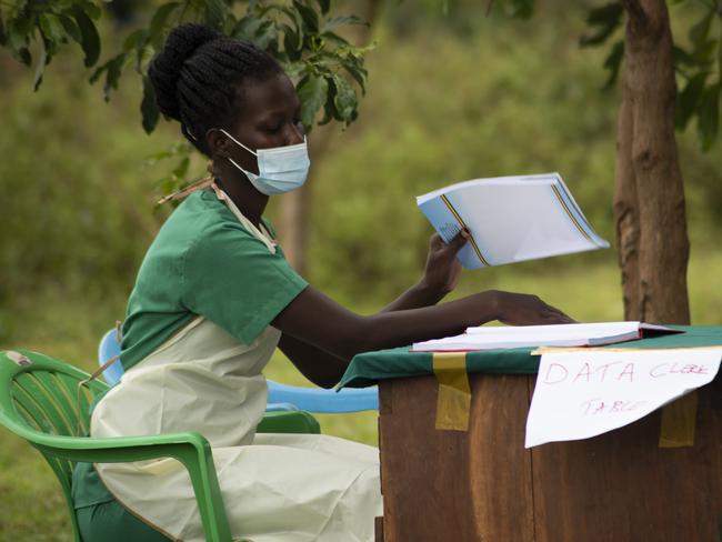 Nurse Nakanyike Victor works at a UNICEF-run vaccination hub in Uganda. Companies such as Bupa, Qantas and NAB are pledging funds to support vaccinations through UNICEF, for every staff member to get the jab.