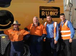 COMMITMENT: From left Tony Kennedy, Ian Thompson, Tom Moodie and Jody Hinds in front of Lismore City Council's new R U OK garbage truck. Picture: Jackie Munro