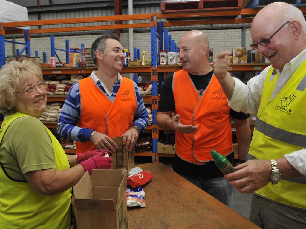 volunteer Bozena Wyrzuk, Guy Zangari, John Robertson &amp; Gerry Anderson. work at the Foodbank in Wetherill Park.