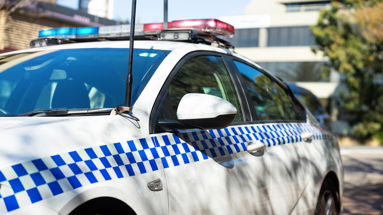 A female police officer was struck by the door of a moving car, which was then used to ram a police vehicle, when a tried to escape after being recognised as being wanted on a warrant.