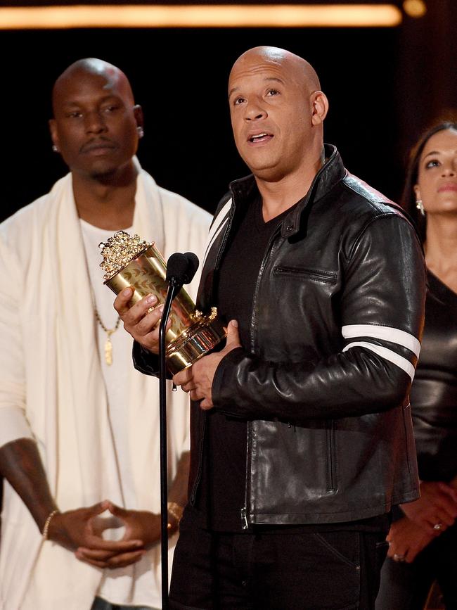 Gibson (at left, with Vin Diesel) warned fans before the court date he might be arrested. Picture: Getty