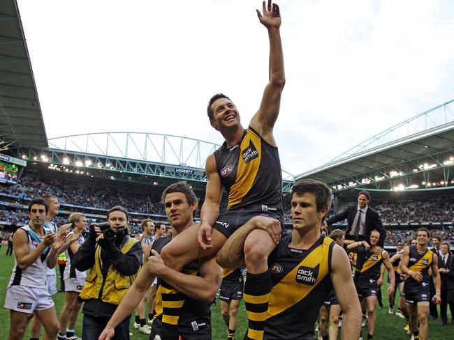 Ben Cousins is lifted on his Tiger teammates’ shoulders as he leaves the ground in 2010. Picture: Scott Barbour/Getty