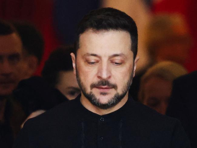 Ukraine's President Volodymyr Zelensky reacts as he leaves after attending a summit held at Lancaster House in central London on March 2, 2025. UK Prime Minister Keir Starmer on March 2, 2025 warned that European security faced a once-in-a-generation moment, as he hosted crisis talks in London on the Russian invasion of Ukraine, just days after a Kyiv-Washington clash. Eighteen allies were gathered on the key question of security guarantees for Ukraine, all the more pressing after US President Donald Trump berated his Ukrainian counterpart Volodymyr Zelensky in an unprecedented White House blow-up. (Photo by Toby Melville / POOL / AFP)