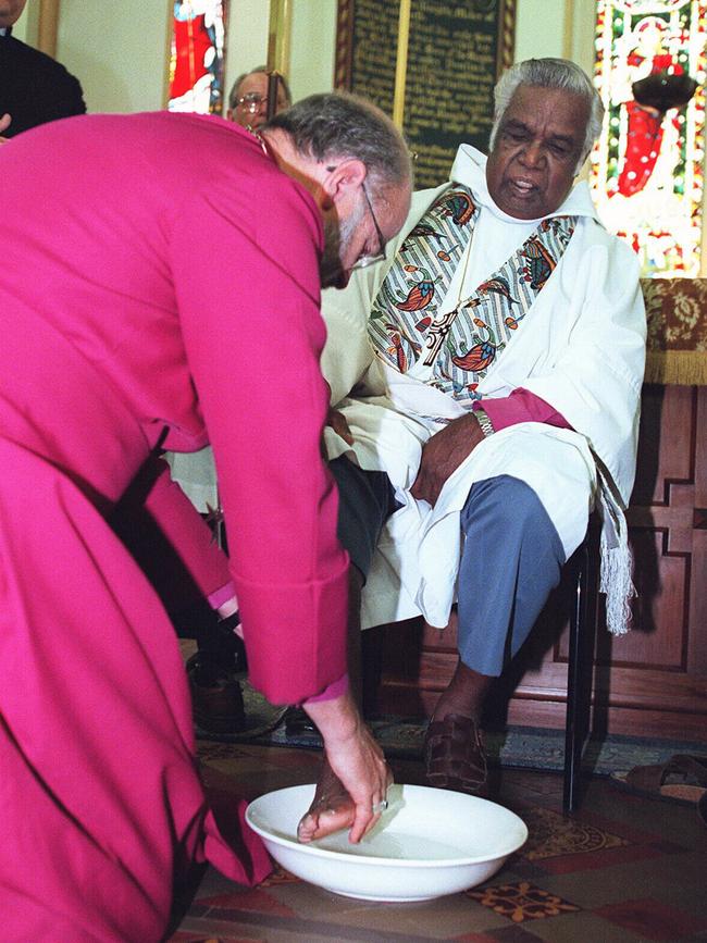 Archbishop of Adelaide, Most Reverend Ian George washes the feet of Indigenous (Aboriginal) bishop, Arthur Malcolm, as an act of reconciliation performed in Christ Church, North Adelaide, 20/02/98.