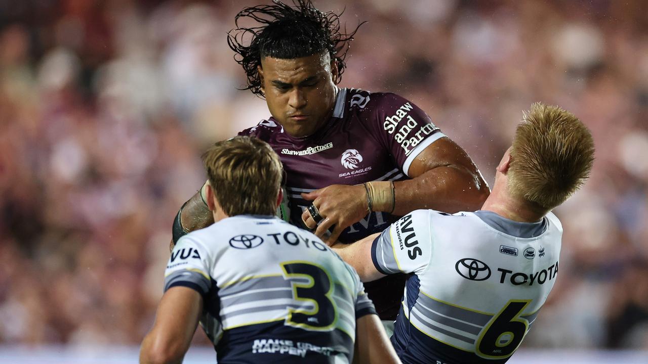 Haumole Olakau'atu of the Sea Eagles is tackled by Jaxon Purdue and Tom Dearden during the round one NRL match between Manly Sea Eagles and North Queensland Cowboys at 4 Pines Park, on March 08, 2025, in Sydney, Australia. (Photo by Cameron Spencer/Getty Images)