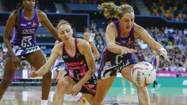 Adelaide Thunderbirds centre Jade Clarke and her Queensland Firebirds counterpart Erin Burger compete for the ball. Picture: Glenn Hunt.