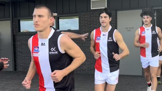 St Kilda City players run out.