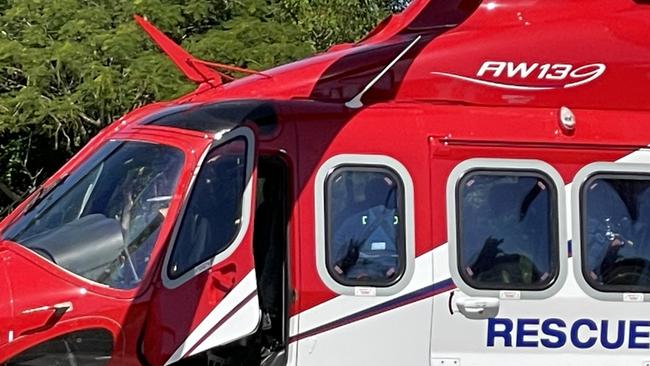 Rescuers touch down at Mackay Base Hospital after winching a man found clinging to an overturned boat 150km off the coast of Mackay. Picture: Janessa Ekert