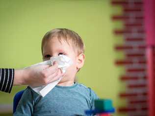 Come on sweetie, let's wipe that obvious snot away before I drop you off at child care. Picture: Thinkstock