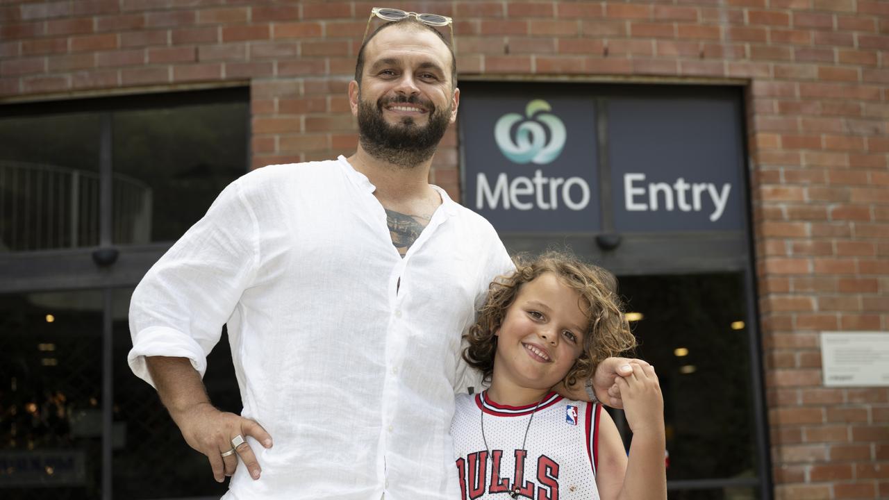 Owner of small business ‘Simon says Juice’, Simon Fowler with his son Fern Fowler 6yrs outside Woolworths in Surry Hills. Picture: NCA NewsWire / Monique Harmer