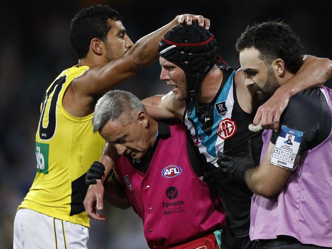 ADELAIDE, AUSTRALIA - OCTOBER 16: Marlion Pickett of the Tigers acknowledges Brad Ebert of the Power as he is taken from the ground after suffering a concussion during the AFL First Preliminary Final match between the Port Adelaide Power and Richmond Tigers at Adelaide Oval on October 16, 2020 in Adelaide, Australia. (Photo by Ryan Pierse/Getty Images)