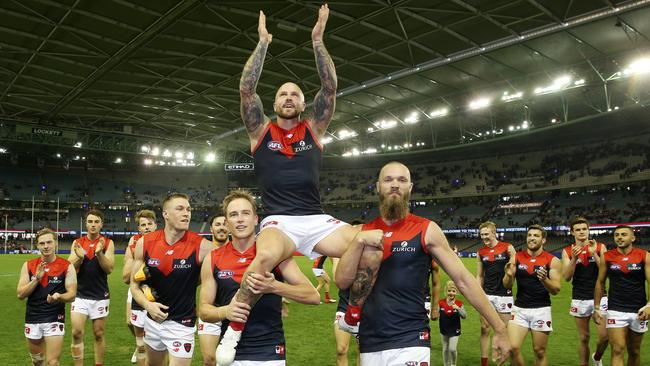 Melbourne captain Nathan Jones gets chaired off after his 250th. Picture: Michael Klein