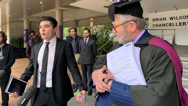 Student activist Drew Pavlou beside barrister Tony Morris QC outside the University of Queensland on Wednesday, May 20. Picture: Michael McKenna