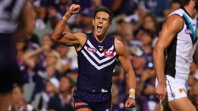 Matthew Pavlich celebrates a goal against Port Adelaide.