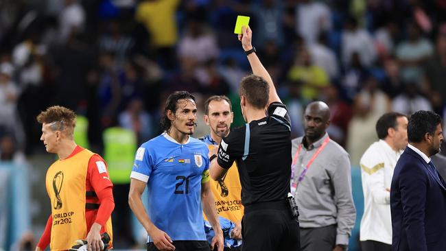 Edinson Cavani is shown a yellow card by referee Daniel Siebert. Picture: Getty