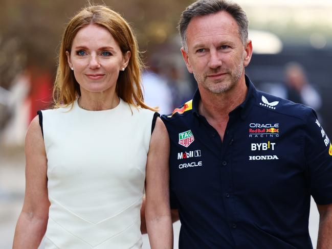 BAHRAIN, BAHRAIN - MARCH 02: Oracle Red Bull Racing Team Principal Christian Horner and Geri Horner walk in the Paddock holding hands prior to the F1 Grand Prix of Bahrain at Bahrain International Circuit on March 02, 2024 in Bahrain, Bahrain. (Photo by Mark Thompson/Getty Images)