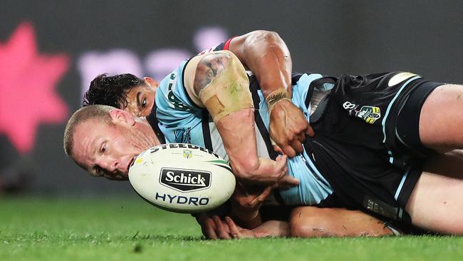 Latrell Mitchell with an incredible try saving tackle on Luke Lewis. Picture: Brett Costello