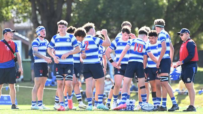 Nudgee’s Adam Latham (second from the left, pink boots) set up an incredible try on Saturday scored by Nick Conway (left, No.14). Picture, John Gass