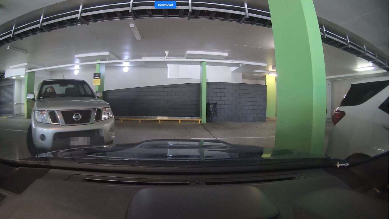 A Nissan Navara seen pulling out of a car park at Ashmore City shopping centre after appearing to damage a blue Subaru sedan. Picture: Facebook/Dash Cam Owners Australia