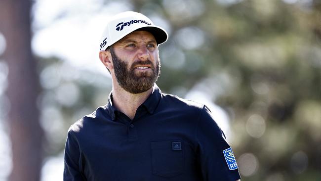 (FILES) In this file photo taken on April 15, 2022, Dustin Johnson walks off the 17th tee during the second round of the RBC Heritage at Harbor Town Golf Links in Hilton Head Island, South Carolina. – The Royal Bank of Canada ended its sponsorship of golfers Dustin Johnson and Graeme McDowell on June 1, 2022 after they were included in the field for the first event of the Saudi-backed LIV Golf Invitational Series event in England. (Photo by Jared C. Tilton / GETTY IMAGES NORTH AMERICA / AFP)