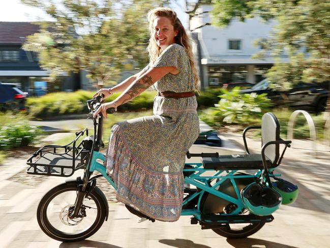 **HOLD FOR NWK** WEEKEND TELEGRAPHS SPECIAL. MAY 11, 2023. PLEASE CONTACT WEEKEND PIC EDITOR JEFF DARMANIN BEFORE PUBLISHING.Pictured is Bondi mum Monique Svenson with her "Lug+Carrie" e-bike which she has had for more than a year, dropping her kids off at school every day on the way to work in her shop, Young Bondi.. Picture: Tim Hunter.