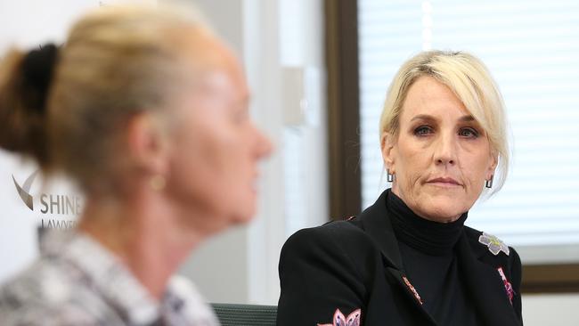 High profile American legal clerk Erin Brockovich looks on as Tanya Moratti speaks at Shine Lawyers in Brisbane, Monday, October 21, 2019. Shine Lawyers have been lobbying at national and state levels for stricter regulations in the stone industry in reaction to one of their clients dying from silicosis.