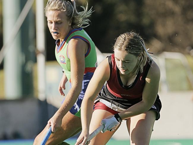 Philly Bridley chased by Jean Flanagan in the Diamonbacks v OHA hockey match at the Tasmanian Hockey Centre, New Town.Picture: MATHEW FARRELL