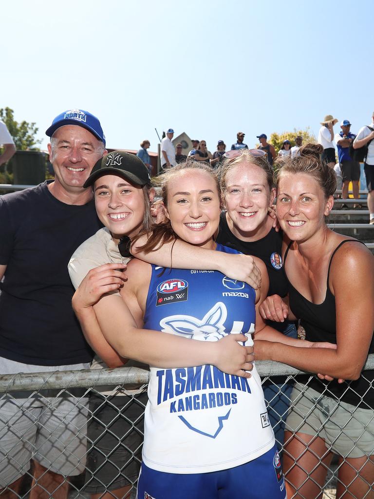 Nicole Bresnehan celebrates winning her first AFLW match with her father Adrian Bresnehan, back left, and friends Mel Wise, Darcy Elliston and Jacinta Limbrick. Picture: LUKE BOWDEN