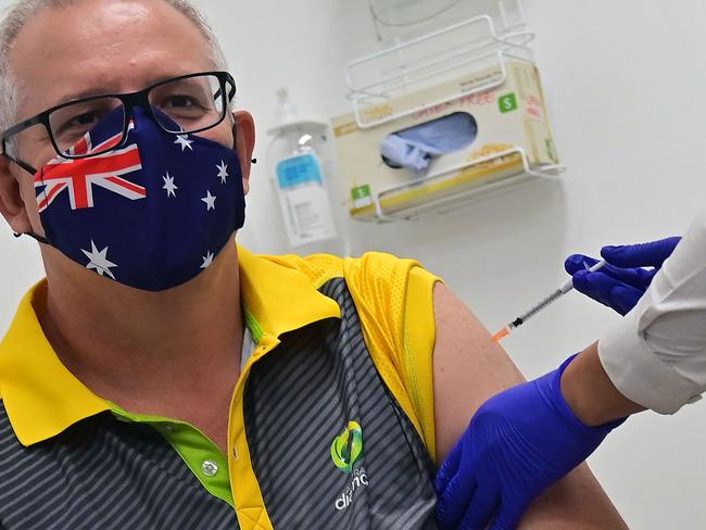 Australia's Prime Minister Scott Morrison receives a dose of the Pfizer/BioNTech Covid-19 vaccine at the Castle Hill Medical Centre in Sydney on February 21, 2021. (Photo by Steven SAPHORE / AFP)