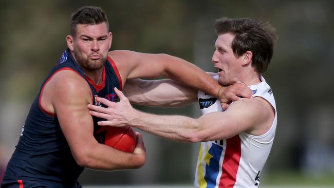 Norwood’s Mitch Grigg tries to fend off Central's Trent Goodrem. Picture: AAP Image/Dean Martin