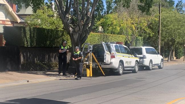 Police returned to the crash site just after 3:30pm on Sunday and took photos and measurements of the street. Picture: George Yankovich