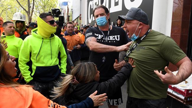 John Setka, centre, tries to calm down an angry unionist during a day of violent protests. Picture: AAP