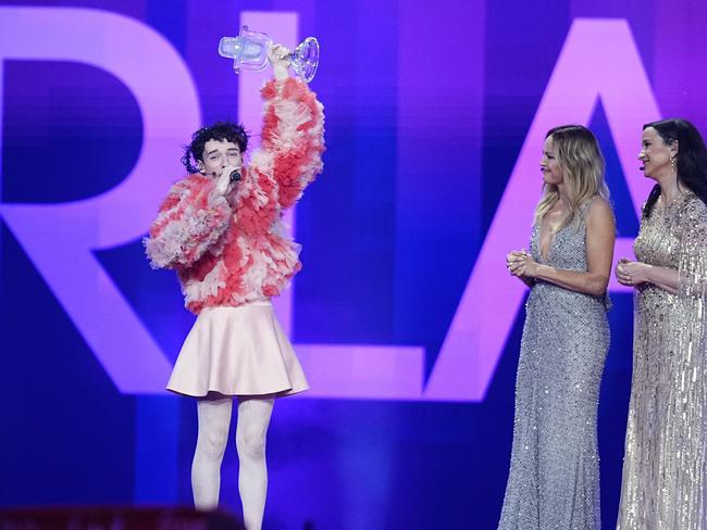 A jubilant Nemo, from Switzerland, celebrates their win as hosts Malin Akerman and Petra Mede look on. Picture: Getty Images