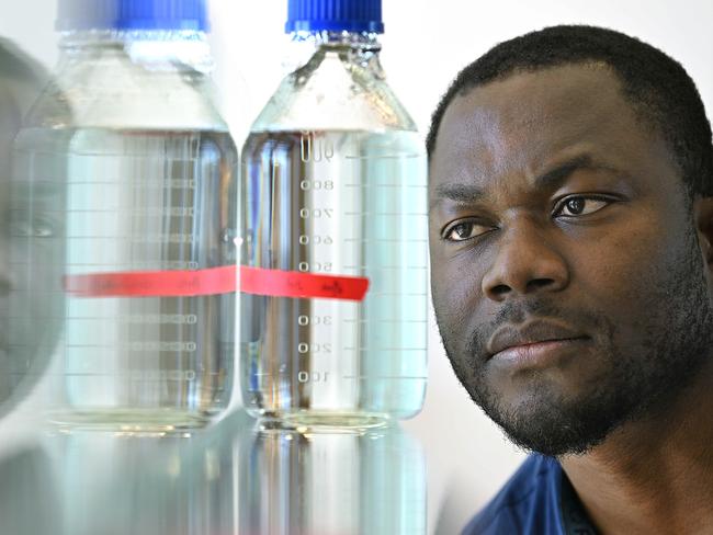 19/4/2024 : Researcher Dr Elvis Okoffo with samples of water he tests fand measures Nanoplastics, in a lab at Queensland Alliance for Environmental Health Sciences (QAEHS) . Nanoplastics are minuscule bits of plastic, measuring less than one micrometre, which is about one sixtieth the size of a grain of salt, so small they've not previously been able to be measured. pic: Lyndon Mechielsen/Courier Mail