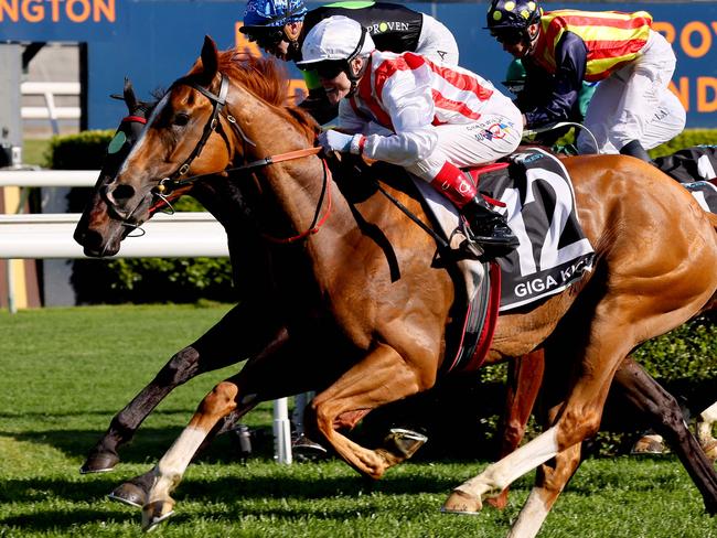 Giga Kick (R), ridden by jockey Craig Williams, wins the Everest 2022 horse race at the Royal Randwick race course in Sydney on October 15, 2022. (Photo by DAVID GRAY / AFP) / XGTY-- IMAGE RESTRICTED TO EDITORIAL USE - STRICTLY NO COMMERCIAL USE --