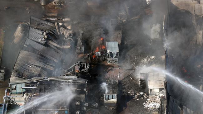 Firefighters battled the large factory fire in Campbellfield for several days. Picture: Alex Coppel.